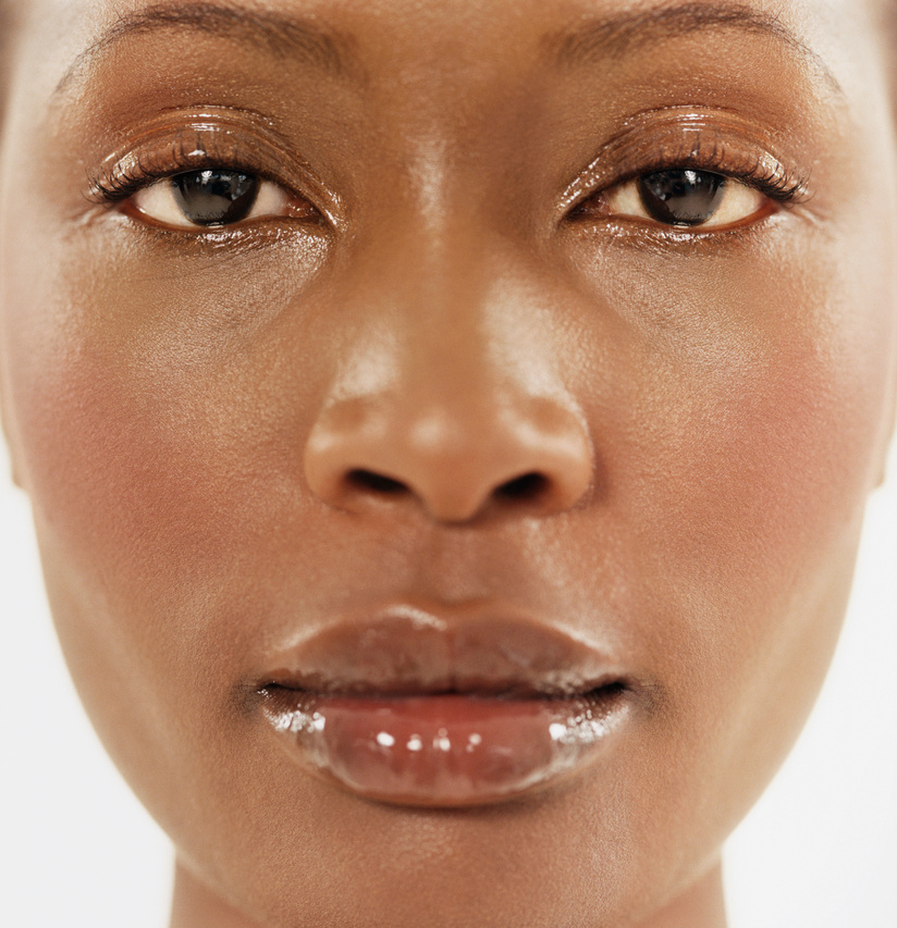 Close-up of the Face of a Woman Wearing Shiny Lip-gloss